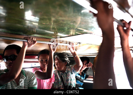 A street view in a Jeepney. Jeepneys are the most popular means of public transport in the Philippines. Stock Photo