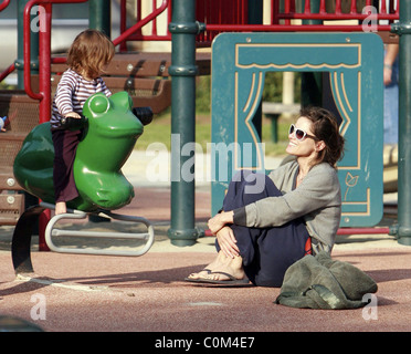 Actress Amanda Peet with husband David Benioff and daughter Frances playing in Beverly Hills Park Los Angeles, California - Stock Photo