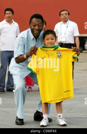 Former Brazilian footballing legend Pele at China's Imperial Palace where he presented signed footballs and football shirts to Stock Photo