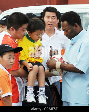 Former Brazilian footballing legend Pele at China's Imperial Palace where he presented signed footballs and football shirts to Stock Photo