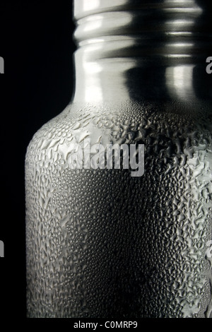 Water Condensation Drops on Cold Water Bottle Stock Photo