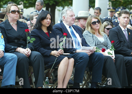 The bereaved hold their rose before placing on the National Law Enforcement Officers Memorial at the 17th Annual Wreath laying Stock Photo