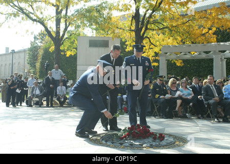 The bereaved hold their rose before placing on the National Law Enforcement Officers Memorial at the 17th Annual Wreath laying Stock Photo