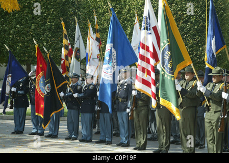 The bereaved hold their rose before placing on the National Law Enforcement Officers Memorial at the 17th Annual Wreath laying Stock Photo