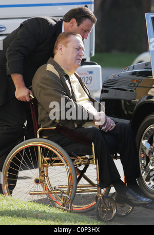 Larry Flynt gets picked up in his golden wheelchair by his driver while ...