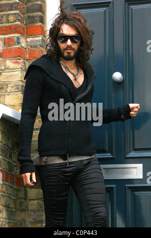 Russell Brand leaves his house this morning the day after he quit his job at the BBC following the four prank phone calls made Stock Photo