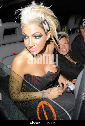 Jodie Marsh repeats her antics of a few months ago, by hanging out of her taxi while it drives around London, having spent the Stock Photo