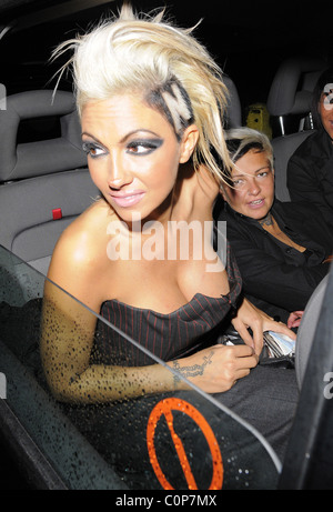 Jodie Marsh repeats her antics of a few months ago, by hanging out of her taxi while it drives around London, having spent the Stock Photo