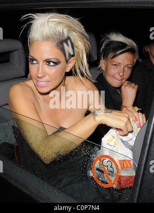 Jodie Marsh repeats her antics of a few months ago, by hanging out of her taxi while it drives around London, having spent the Stock Photo