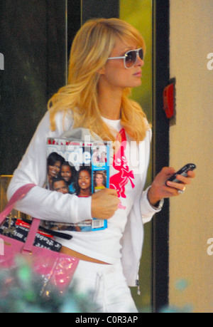 Paris Hilton wearing a monogram T-shirt with her name and a pink Chihuahua dog, leaves her hotel in Hollywood clutching all the Stock Photo