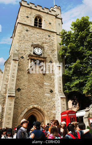 Tourists near a clock tower, Carfax Tower, Oxford, Oxfordshire, England