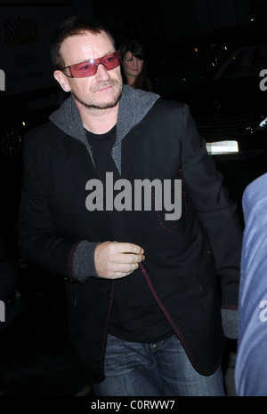Bono leaving a private party, held at the home of Barclays senior executive Roger Jenkins, at 3.30am. The event was to raise Stock Photo