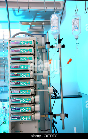 Intensive care unit in a hospital. A patient is connected to different life support systems. Stock Photo