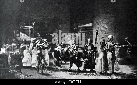 An Apis bull, perfumed with oils and decorated with garlands, marches in a procession in Memphis attended by priests and others. Stock Photo