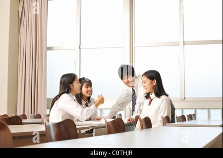 High School Students Talking in Classroom Stock Photo