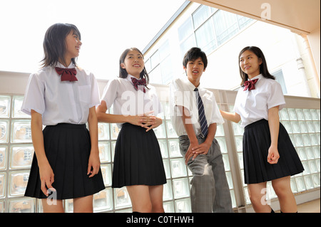 High School Students Talking at Hallway Stock Photo