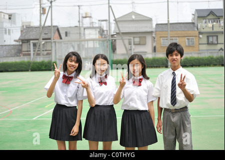 High School Students Standing in the Schoolyard Stock Photo