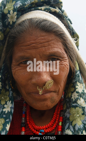 portrait of an older Tharu woman in Chitwan National Park in Nepal Stock Photo