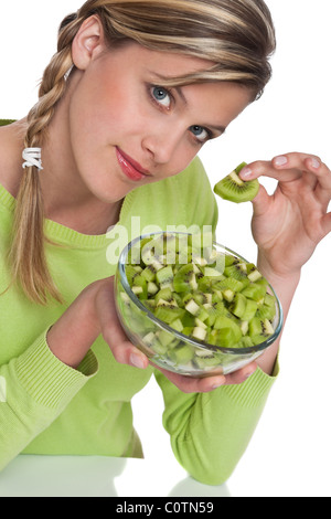 Woman holding slice of kiwi on white background Stock Photo