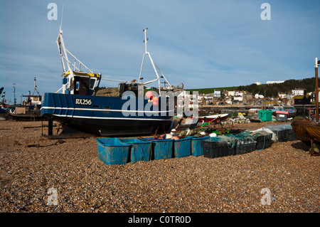 Fishing Boats On The Stade With The Town Of Hastings In The Background East Sussex England Stock Photo