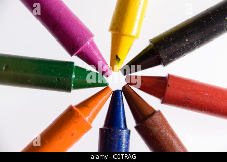 Close up on Tips of 8 Colourful Crayons in a Circle Star Shape, Isolated on White Stock Photo