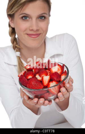 Healthy lifestyle series - Woman and bowl of strawberries on white background Stock Photo