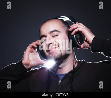 portrait of young confident man wearing headphone Stock Photo