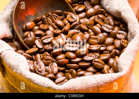 Sack of coffee beans and scoop.