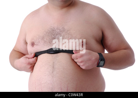 Fat man preparing to workout, adjusting heart rate monitor Stock Photo