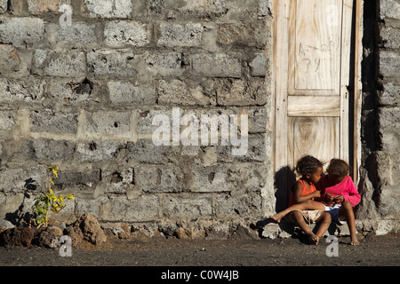 Children sit on the doorstep of a home in Cha de Caldeiras, Fogo Island, Cape Verde on Wednesday January 5, 2011. Stock Photo