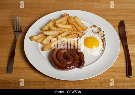 Sausage, egg and chips. Stock Photo