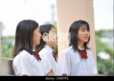 High School Girls Talking at Hallway Stock Photo