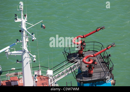 Firefighting cannons jets onboard tug vessels. Stock Photo