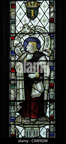 A stained glass window by C E Kempe & Co. depicting St John the Evangelist, All Saints Church, Braunston, Rutland Stock Photo