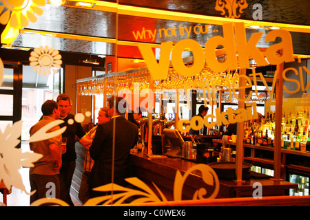 People the 'Bar Room Bar' in the Mailbox shopping complex with many cafes bars and restaurants. Birmingham, England, UK. Stock Photo