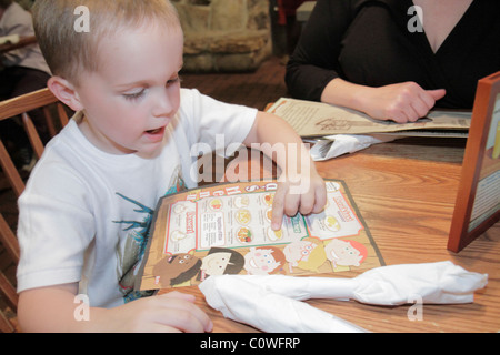 Orlando Florida,Cracker Barrel,restaurant restaurants food dining eating out cafe cafes bistro,young,preschool,boy boys lad lads male kid kids child c Stock Photo