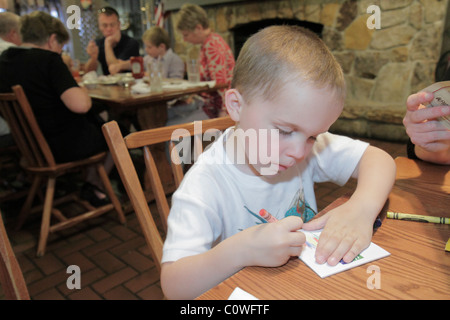 Orlando Florida,Cracker Barrel,restaurant restaurants food dining eating out cafe cafes bistro,young,preschool,boy boys lad lads male kid kids child c Stock Photo