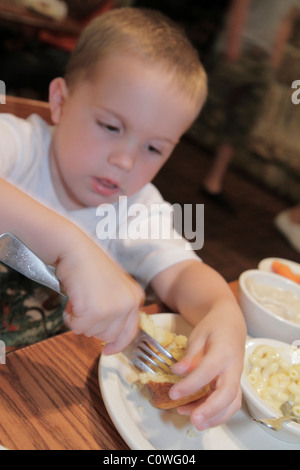 Orlando Florida,Cracker Barrel,restaurant restaurants food dining eating out cafe cafes bistro,young,preschool,boy boys lad lads male kid kids child c Stock Photo