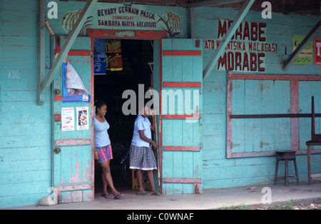 Turquoise & Red Painted Wooden Shop, Convenience Store, Corner Shop or General Store on the Main Street, Sambava, Madagascar Stock Photo