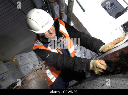 Construction workers working on office building roof, Edinburgh Scotland UK Stock Photo