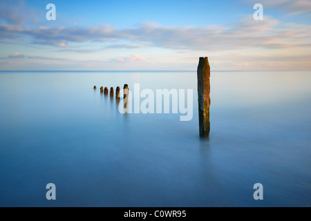 Long exposure and sea defences along the southern coastline at Winchelsea beach, East Sussex. Stock Photo