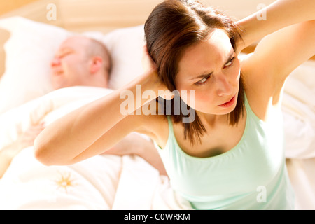 Woman fed up of partner snoring Stock Photo