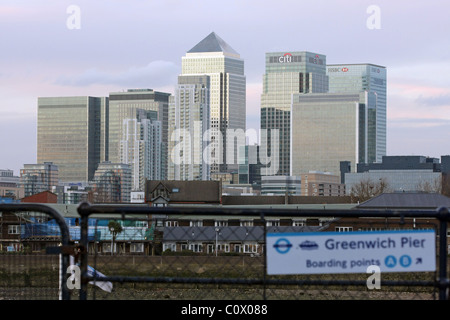 Looking from the Thames Path across the River Thames towards Canary Wharf Stock Photo