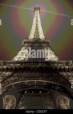 The Eiffel Tower lit up at night in Paris, France. Stock Photo