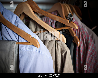 Clothes on wooden coat hangers Stock Photo