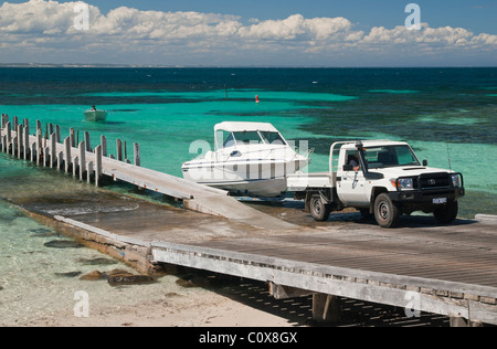 A ute tows a boat up a boat ramp in the town of Augusta, Western Australia Stock Photo