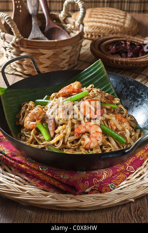 Char kway teow.Stir fried noodles on banana leaf. South East Asia Food Stock Photo