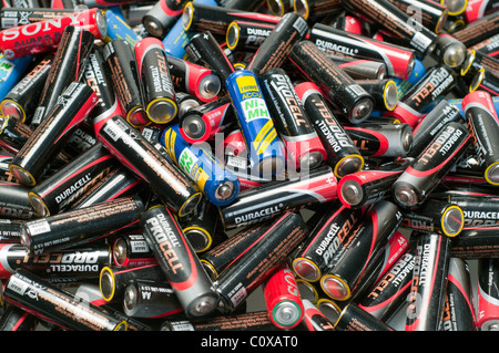A collection of used batteries waiting to be recycled. Stock Photo