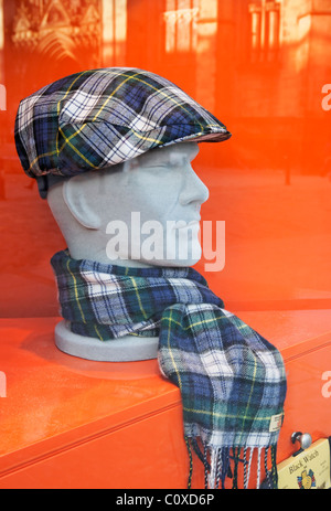 Tartan Barnton cap and scarf on a mannequin head in a shop window on the Royal Mile, Edinburgh, Scotland, UK. Stock Photo