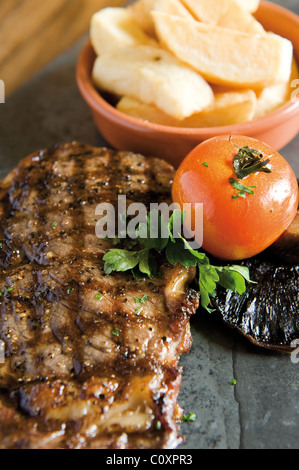 Cooked Rib eye steak Stock Photo